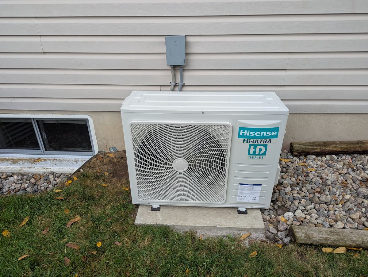 Hisense cold-climate heat pump installed beside a home