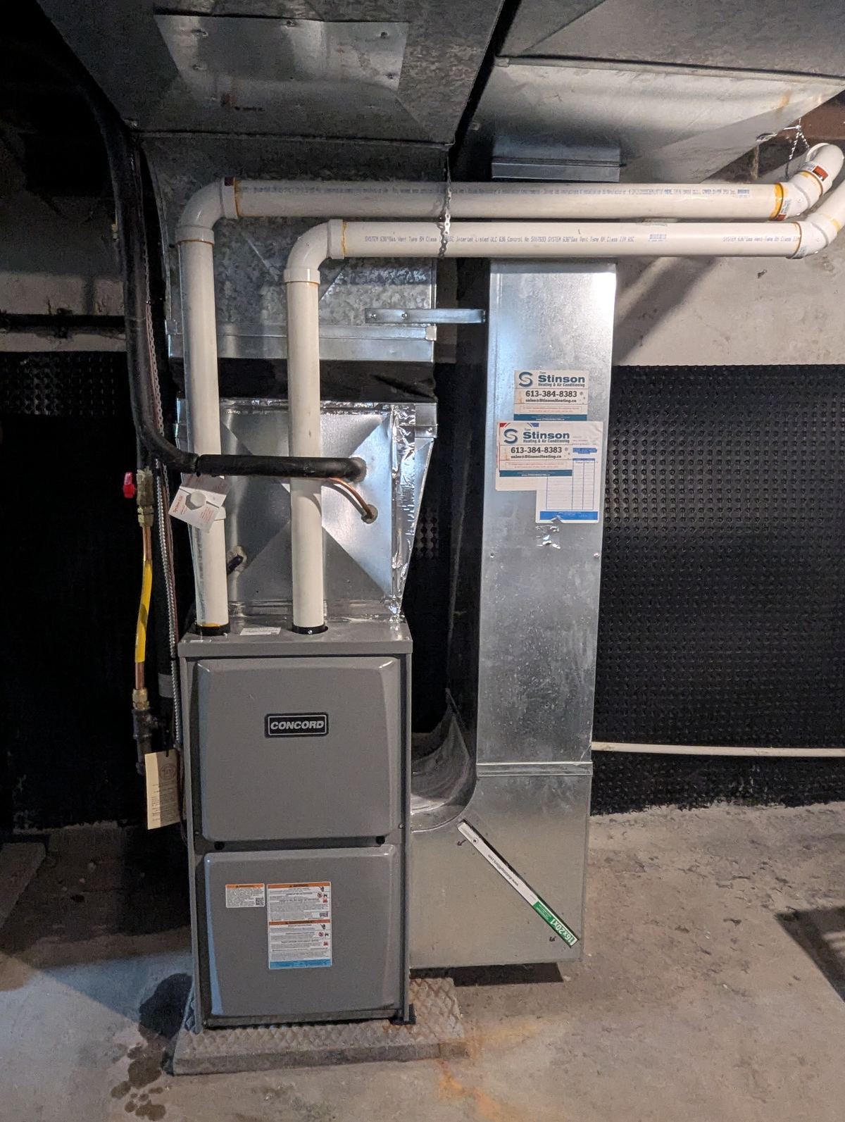 Concord furnace installation with T.H. Stinson's service labels