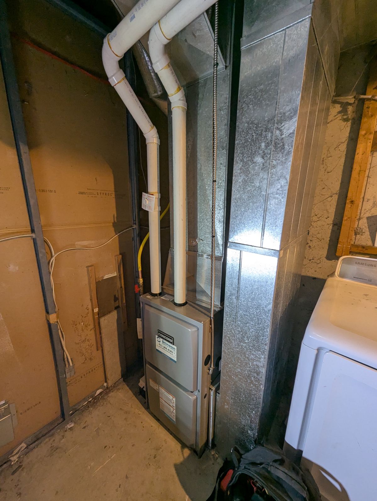 Completed furnace installation in an unfinished basement